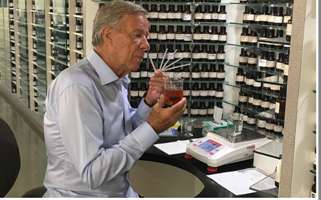 Bernhard Winkler evaluating a fragrance at his perfume organ